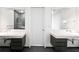 Modern bathroom with double sinks, wall mirrors and glass shower at 45 Ivan Allen Jr Nw Blvd # 1908, Atlanta, GA 30308