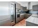 Contemporary kitchen showcasing stainless steel appliances, modern cabinetry, and wood flooring at 45 Ivan Allen Jr Nw Blvd # 1908, Atlanta, GA 30308