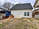 Backyard of a renovated home with a gray exterior and a door leading to the backyard at 958 Joseph E Boone Nw Blvd, Atlanta, GA 30314