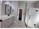 Bathroom with a white marble floor, a glass enclosed shower, and a vanity with a black faucet at 958 Joseph E Boone Nw Blvd, Atlanta, GA 30314