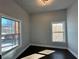 Bright bedroom showcasing two large windows and dark hardwood floors at 958 Joseph E Boone Nw Blvd, Atlanta, GA 30314