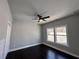 Bedroom featuring hardwood floors, ceiling fan, and natural light from the windows at 958 Joseph E Boone Nw Blvd, Atlanta, GA 30314