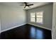 Bedroom featuring hardwood floors, ceiling fan, and natural light from the windows at 958 Joseph E Boone Nw Blvd, Atlanta, GA 30314