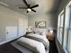 A bedroom features natural light and a ceiling fan at 958 Joseph E Boone Nw Blvd, Atlanta, GA 30314