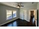 Bright bedroom features a ceiling fan, natural light from windows, and hardwood floors at 958 Joseph E Boone Nw Blvd, Atlanta, GA 30314