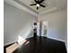 Bedroom with tray ceiling and fan shows doorway to bathroom and doorway to kitchen at 958 Joseph E Boone Nw Blvd, Atlanta, GA 30314