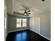 A nice bedroom with tray ceiling, ceiling fan, wood floors and closet at 958 Joseph E Boone Nw Blvd, Atlanta, GA 30314