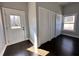 Entryway with dark wood floors, white door, and lots of natural light at 958 Joseph E Boone Nw Blvd, Atlanta, GA 30314