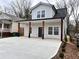 Exterior elevation of a newly renovated house with a gray exterior and a front porch at 958 Joseph E Boone Nw Blvd, Atlanta, GA 30314