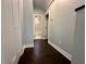 Hallway view of the bathroom featuring dark hardwood floors and modern trim at 958 Joseph E Boone Nw Blvd, Atlanta, GA 30314