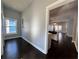 Hallway view of the kitchen with dark hardwood floors and modern trim at 958 Joseph E Boone Nw Blvd, Atlanta, GA 30314