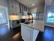 Modern kitchen with gray cabinets, stainless steel appliances, and an island featuring a marble countertop at 958 Joseph E Boone Nw Blvd, Atlanta, GA 30314