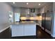 Beautiful kitchen featuring an island with a marble countertop, gray cabinets, and stainless steel appliances at 958 Joseph E Boone Nw Blvd, Atlanta, GA 30314