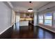 Spacious open-concept living room flowing to kitchen, with hardwood floors and ample lighting at 958 Joseph E Boone Nw Blvd, Atlanta, GA 30314