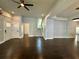 Open living space with hardwood floors, a staircase, and neutral paint at 958 Joseph E Boone Nw Blvd, Atlanta, GA 30314