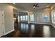 Spacious open-concept living area with hardwood floors, natural lighting, and a ceiling fan at 958 Joseph E Boone Nw Blvd, Atlanta, GA 30314