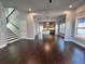 Open-concept living room with abundant natural light, features staircase and view of the kitchen at 958 Joseph E Boone Nw Blvd, Atlanta, GA 30314