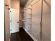 Walk-in closet features a white wire shelving system for optimized storage at 958 Joseph E Boone Nw Blvd, Atlanta, GA 30314