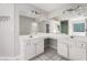 Primary bathroom with double sinks and large vanity mirror at 615 Arncliffe Ct, Alpharetta, GA 30005