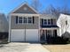 Charming two-story home with a two-car garage, manicured landscaping, and inviting curb appeal at 615 Arncliffe Ct, Alpharetta, GA 30005