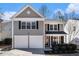 Charming two-story home with a two-car garage and manicured landscaping at 615 Arncliffe Ct, Alpharetta, GA 30005