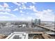 An aerial view showcasing the expansive cityscape, highways, and skyline at 1280 W Peachtree Nw St # 3303, Atlanta, GA 30309
