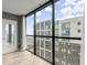 Large glass windows with a balcony overlooking the city at 1280 W Peachtree Nw St # 3303, Atlanta, GA 30309