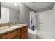 A well-appointed bathroom with granite countertop, white fixtures, and coordinated color scheme at 1280 W Peachtree Nw St # 3303, Atlanta, GA 30309