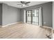 A bright and airy bedroom with neutral paint and slider access to the balcony at 1280 W Peachtree Nw St # 3303, Atlanta, GA 30309