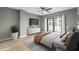 Relax in this bedroom with light-filled space, ceiling fan and neutral colors at 1280 W Peachtree Nw St # 3303, Atlanta, GA 30309