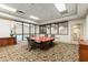 Bright conference room with large windows offering pool views and a large conference table with seating at 1280 W Peachtree Nw St # 3303, Atlanta, GA 30309