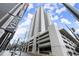 Stunning exterior view of the high-rise condo building, The Mira, with a view of the parking deck at 1280 W Peachtree Nw St # 3303, Atlanta, GA 30309