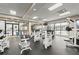 Fully-equipped gym with modern machines, large windows, and views of the surrounding community at 1280 W Peachtree Nw St # 3303, Atlanta, GA 30309