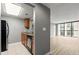 Cozy kitchen offering stainless steel appliances and granite countertops open to living area at 1280 W Peachtree Nw St # 3303, Atlanta, GA 30309