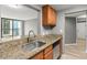Galley kitchen offers stainless steel appliances and granite counters at 1280 W Peachtree Nw St # 3303, Atlanta, GA 30309