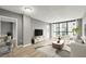 This living room features floor to ceiling windows, fresh paint and durable floors at 1280 W Peachtree Nw St # 3303, Atlanta, GA 30309
