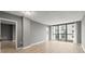 Light-filled living area featuring floor-to-ceiling windows and durable floors at 1280 W Peachtree Nw St # 3303, Atlanta, GA 30309
