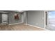 Spacious living room featuring sleek floors, a convenient kitchen pass-through, and balcony access at 1280 W Peachtree Nw St # 3303, Atlanta, GA 30309