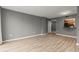 A bright and airy living room showcasing neutral tones and attractive light-colored wood-look flooring at 1280 W Peachtree Nw St # 3303, Atlanta, GA 30309