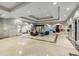 A modern lobby with a sleek marble floor, artistic mural, and comfortable seating area at 1280 W Peachtree Nw St # 3303, Atlanta, GA 30309