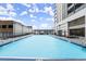 A long, luxurious swimming pool with lounge seating in a serene outdoor setting at 1280 W Peachtree Nw St # 3303, Atlanta, GA 30309