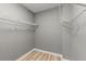 A walk-in closet featuring wire shelving and neutral walls, providing ample storage space at 1280 W Peachtree Nw St # 3303, Atlanta, GA 30309