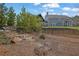 Landscaped backyard with stone steps and retaining wall, leading up to the main house at 1366 Kings Park Nw Dr, Kennesaw, GA 30152