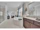 Bathroom featuring double sinks, granite countertops, a soaking tub, and a glass shower at 1366 Kings Park Nw Dr, Kennesaw, GA 30152