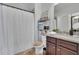 Bathroom with a shower, granite countertops, and modern fixtures and décor at 1366 Kings Park Nw Dr, Kennesaw, GA 30152