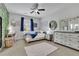 Bright bedroom with a ceiling fan, large windows and decorative touches throughout at 1366 Kings Park Nw Dr, Kennesaw, GA 30152