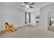 Spacious bedroom with a ceiling fan, neutral walls, and plenty of natural light at 1366 Kings Park Nw Dr, Kennesaw, GA 30152