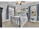Bedroom featuring two windows, neutral walls, and a comfortable place to rest at 1366 Kings Park Nw Dr, Kennesaw, GA 30152