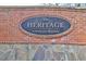Community entrance signage made of brick and stone at The Heritage at Kennesaw Mountain at 1366 Kings Park Nw Dr, Kennesaw, GA 30152