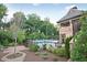 Community pool with surrounding lounge chairs for relaxing, with views of the cabana at 1366 Kings Park Nw Dr, Kennesaw, GA 30152